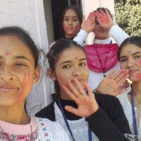 Group of people enjoying Holi festival with colors
