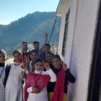 Employees celebrating Holi festival with gulal colors