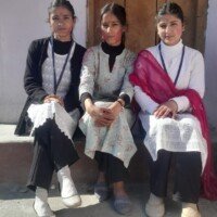 Friends celebrating Holi festival with colors and smiles