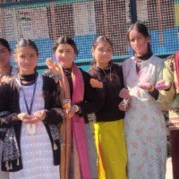 Employees enjoying Holi festival with colorful powders