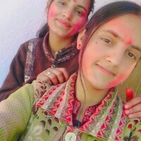 Team members playing Holi with colors outdoors